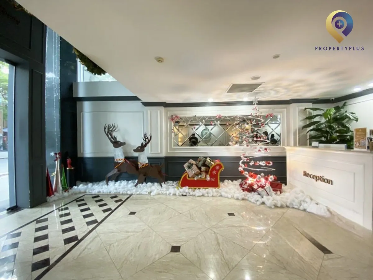 Lobby area of The Imperial Suites building with Christmas decorations.